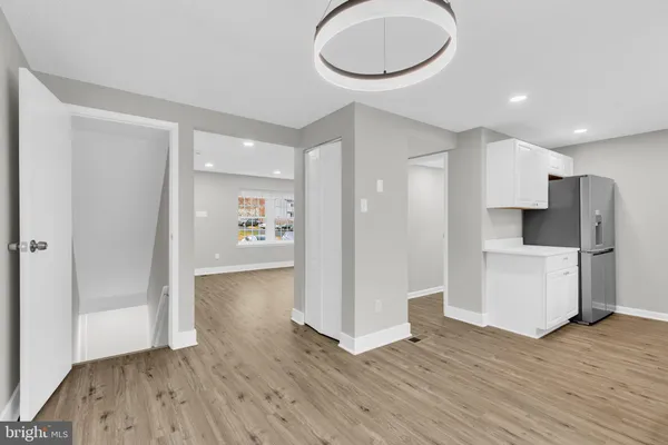 a view of a kitchen cabinets and wooden floor
