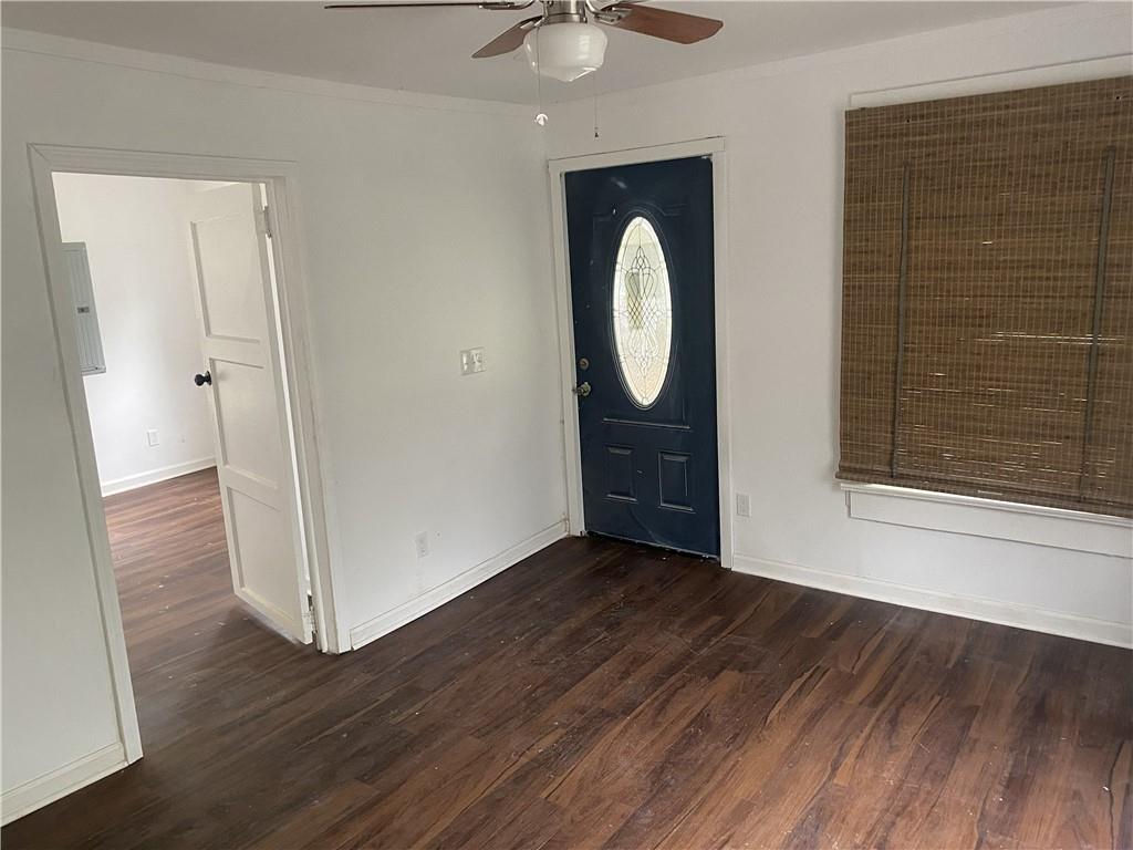 348 Hortman Avenue Macon, GA 31204 - Photo 5 of 18 a view of an empty room with wooden floor and a window