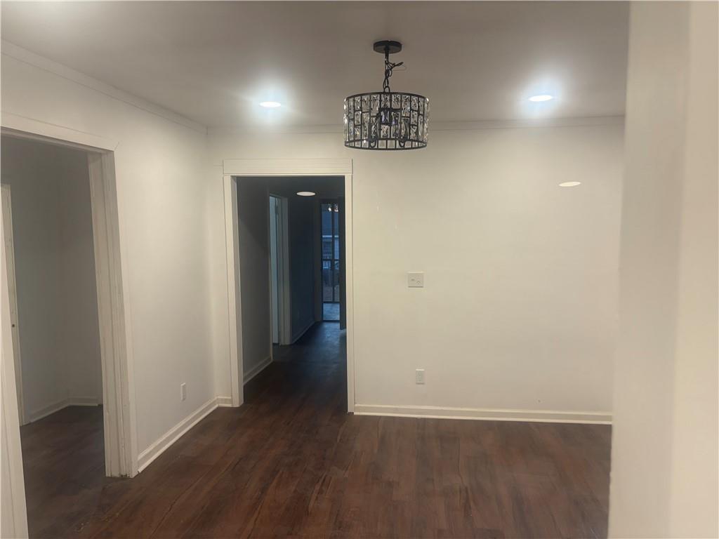 348 Hortman Avenue Macon, GA 31204 - Photo 8 of 18 an empty room with wooden floor and hallway