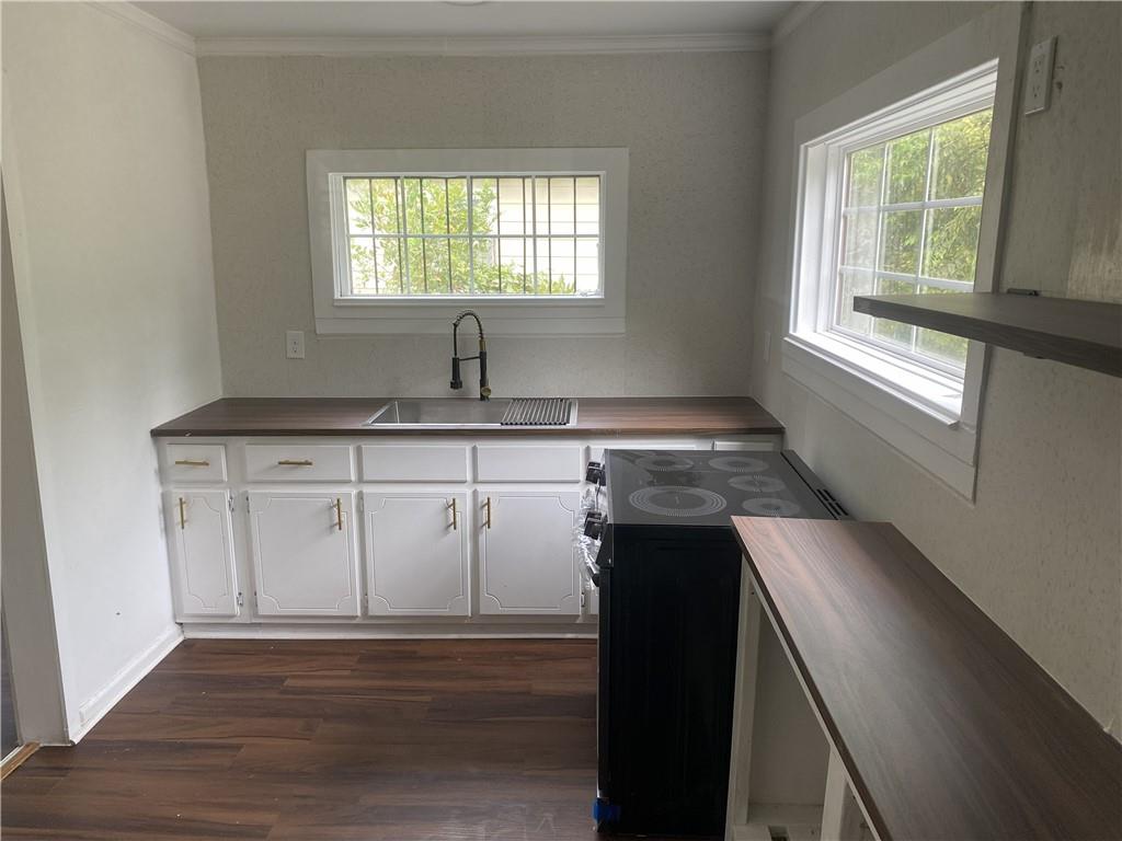 348 Hortman Avenue Macon, GA 31204 - Photo 9 of 18 a kitchen with a sink cabinets and window