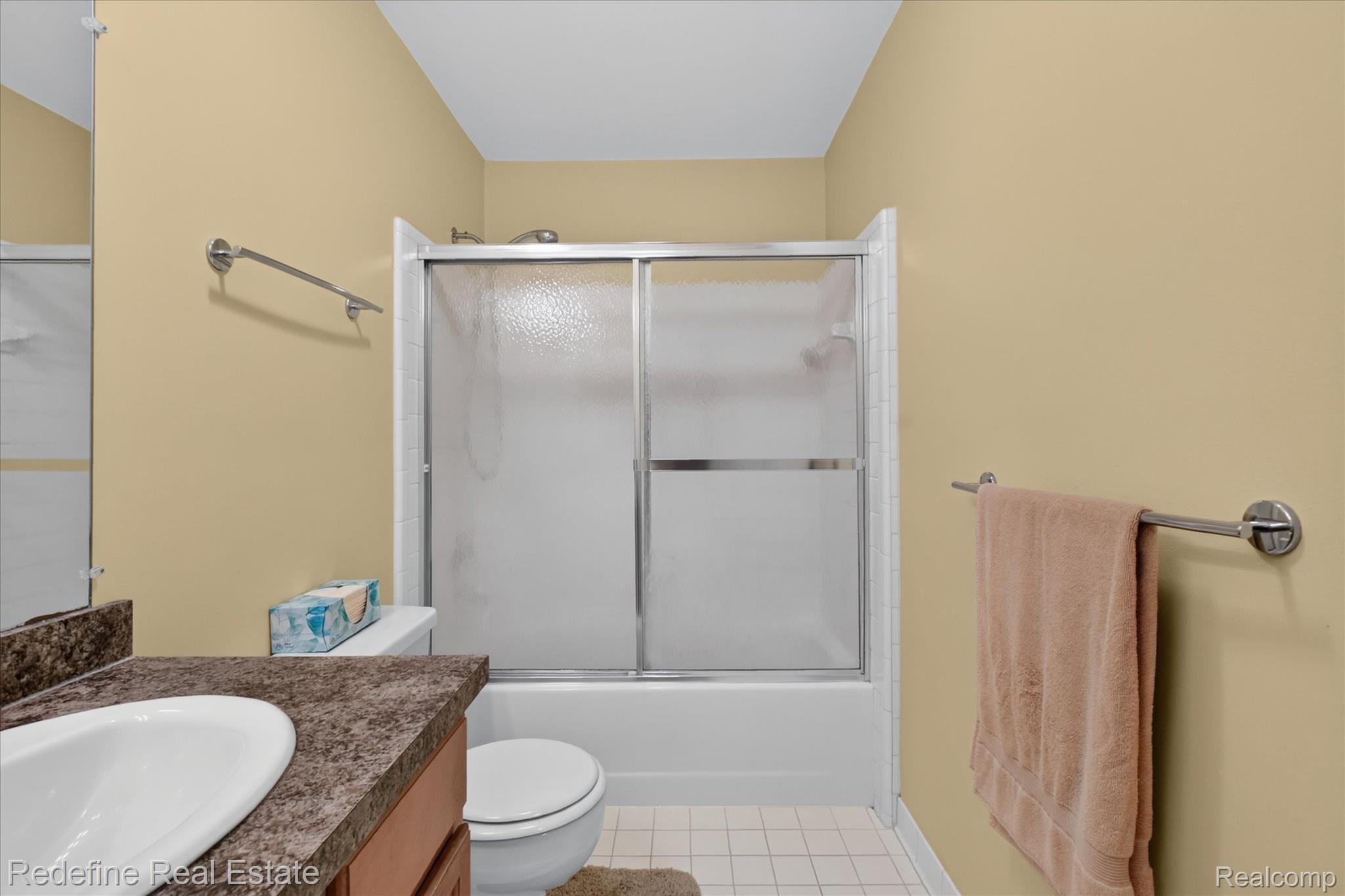 27971 Rollcrest Road, Unit 9 Farmington, MI 48334 - Photo 14 of 25 Built-in vanity with an integrated sink and laminate countertop