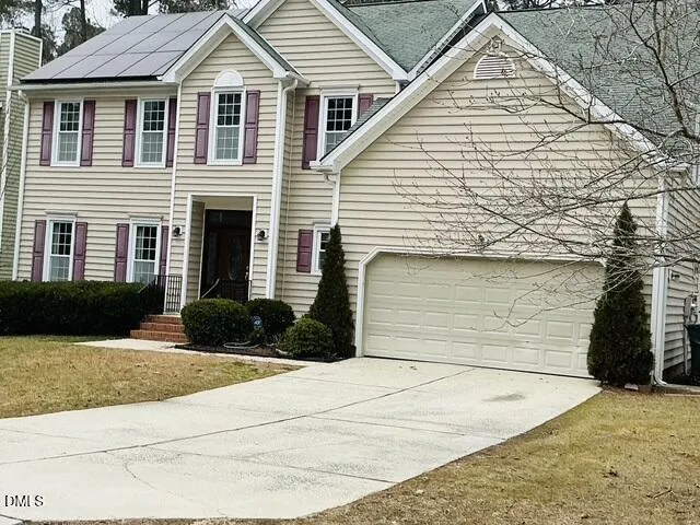 a large kitchen with stainless steel appliances granite countertop a stove and a wooden floors