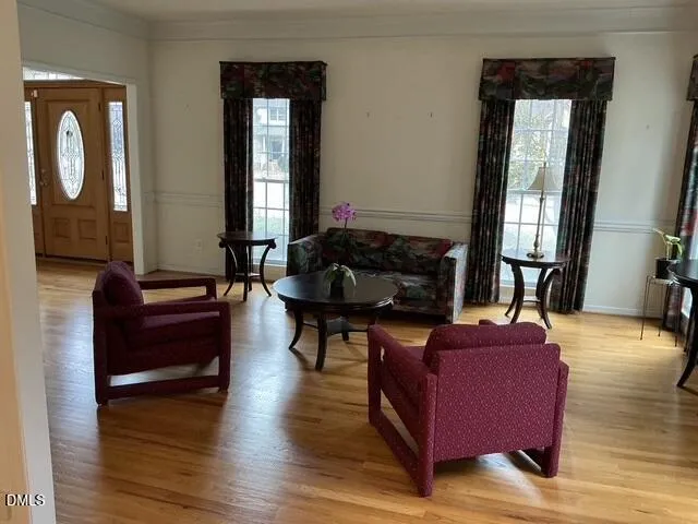 a very nice looking dining room with a table and chandelier