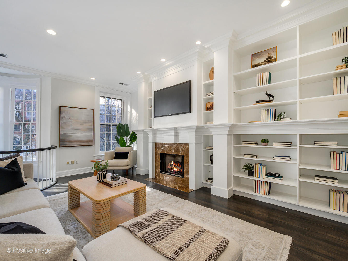 37 East Elm Street Chicago, IL 60611 - Photo 12 of 32 a living room with furniture a fireplace and a flat screen tv