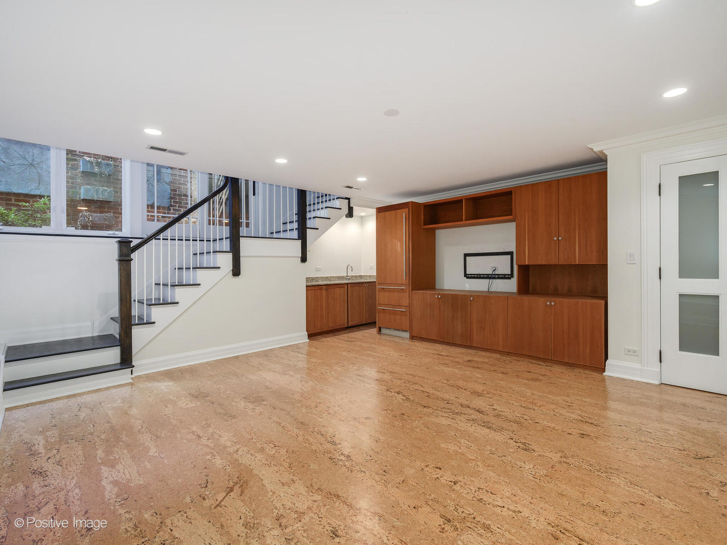 37 East Elm Street Chicago, IL 60611 - Photo 30 of 32 a view of an empty room with stairs and a window