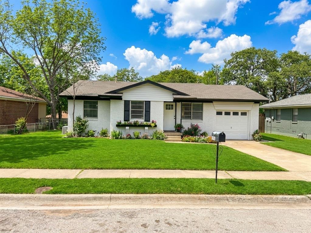 1910 Mercedes Road Denton, TX 76205 - Photo 1 of 5 Single story home with a front lawn, concrete driveway, a garage, brick siding, and a porch