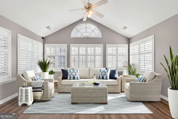 a living room with furniture and a large window