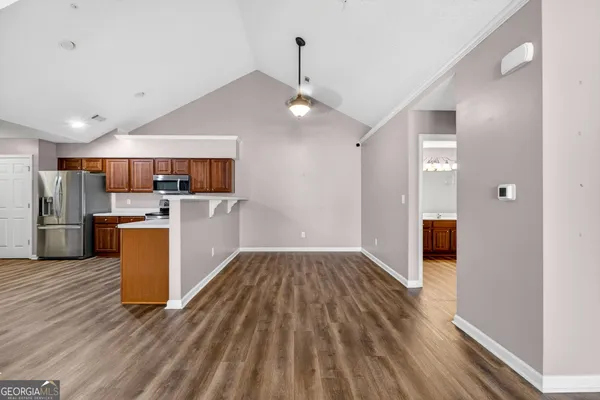a view of a kitchen with a sink and cabinets