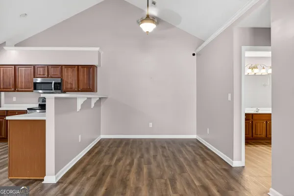 a view of kitchen and wooden floor