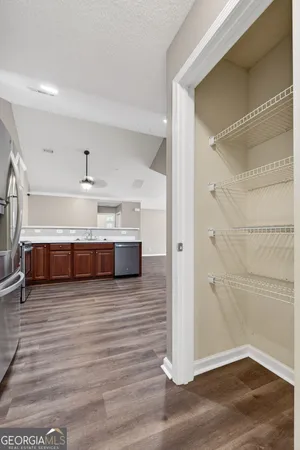 a view of a room with wooden floor