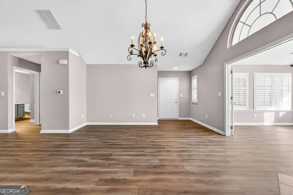 a view of a livingroom with wooden floor