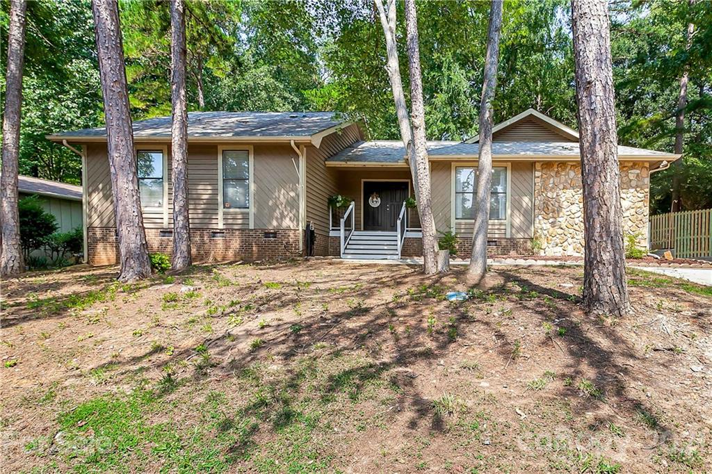 5063 Suwarrow Circle Tega Cay, SC 29708 - Photo 1 of 18 a front view of a house with garden