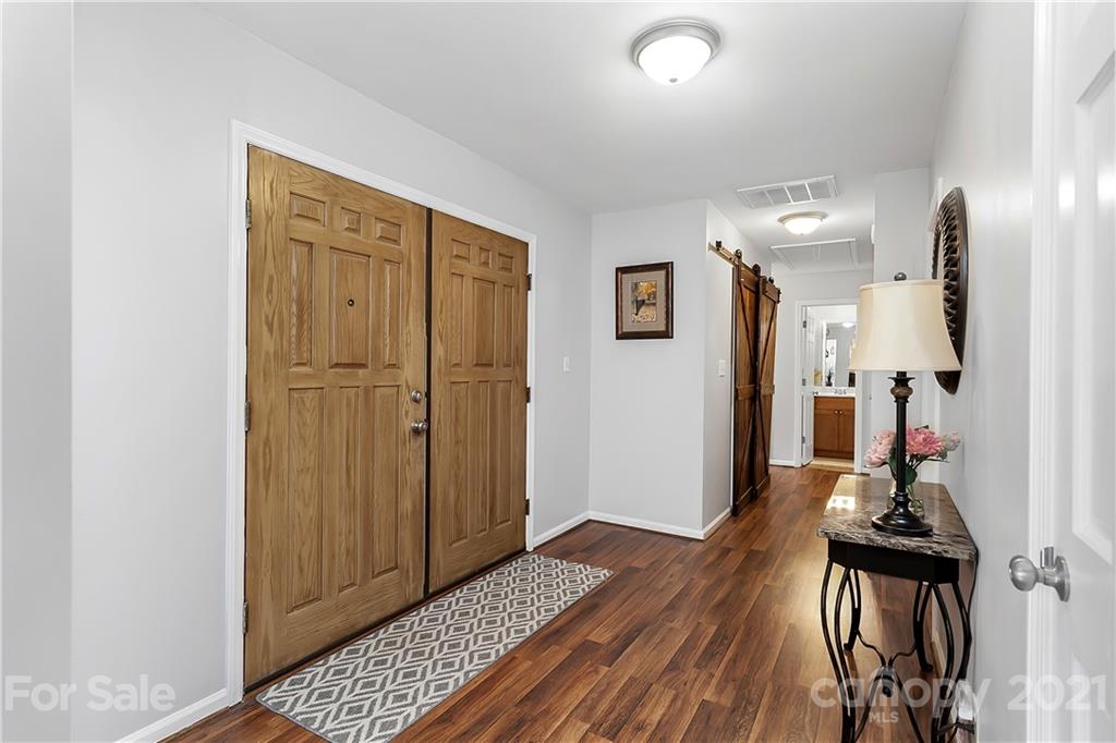 5063 Suwarrow Circle Tega Cay, SC 29708 - Photo 2 of 18 a view of a room with closet and wooden floor