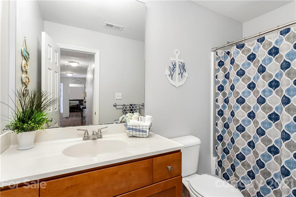 5063 Suwarrow Circle Tega Cay, SC 29708 - Photo 11 of 18 a bathroom with a sink toilet and shower