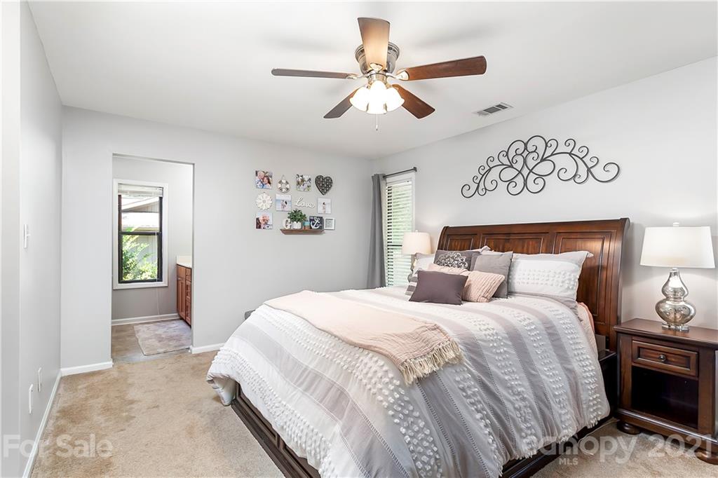 5063 Suwarrow Circle Tega Cay, SC 29708 - Photo 14 of 18 a bedroom with a large bed and a window