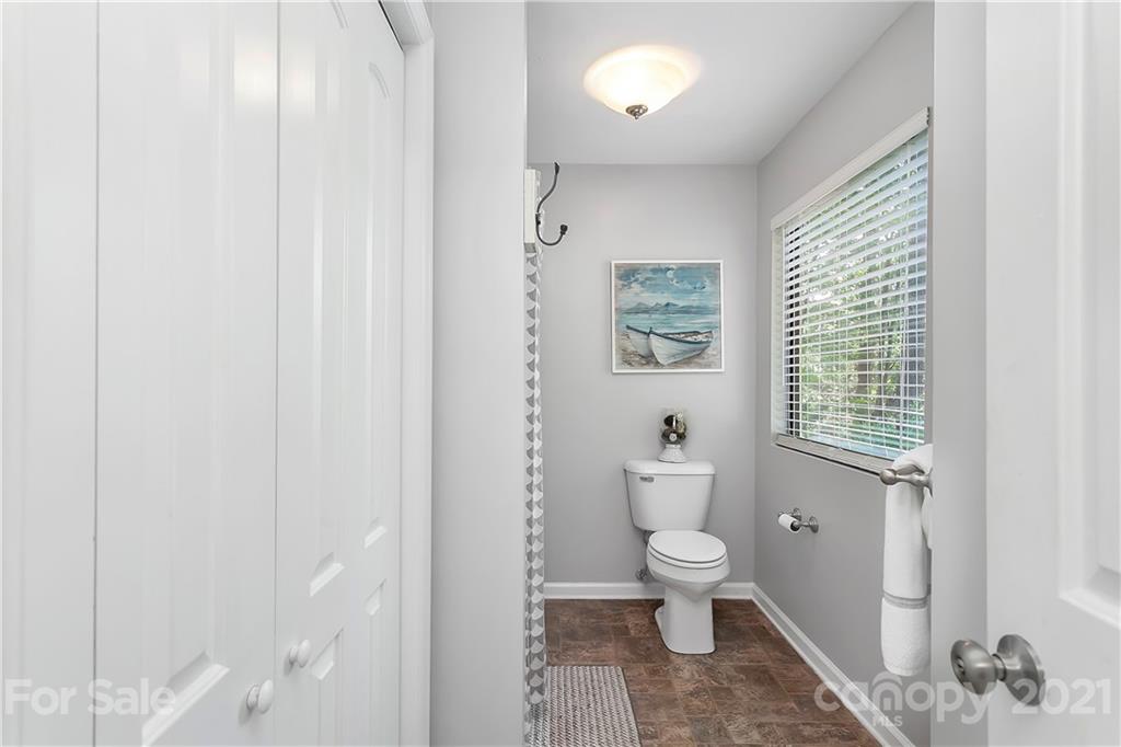 5063 Suwarrow Circle Tega Cay, SC 29708 - Photo 17 of 18 a bathroom with a toilet a window and a shower