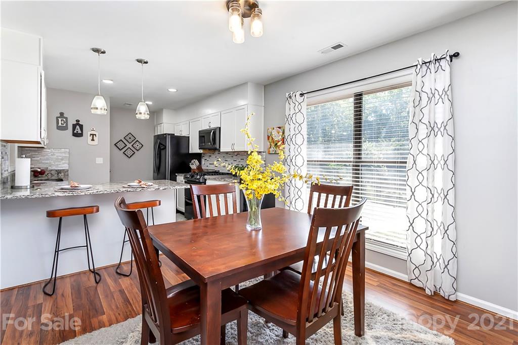 5063 Suwarrow Circle Tega Cay, SC 29708 - Photo 4 of 18 a view of a dining room with furniture window and outside view