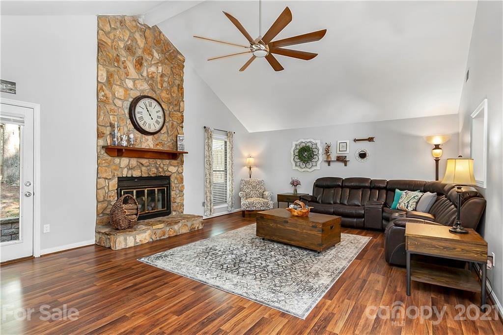 5063 Suwarrow Circle Tega Cay, SC 29708 - Photo 7 of 18 a living room with furniture and a fireplace