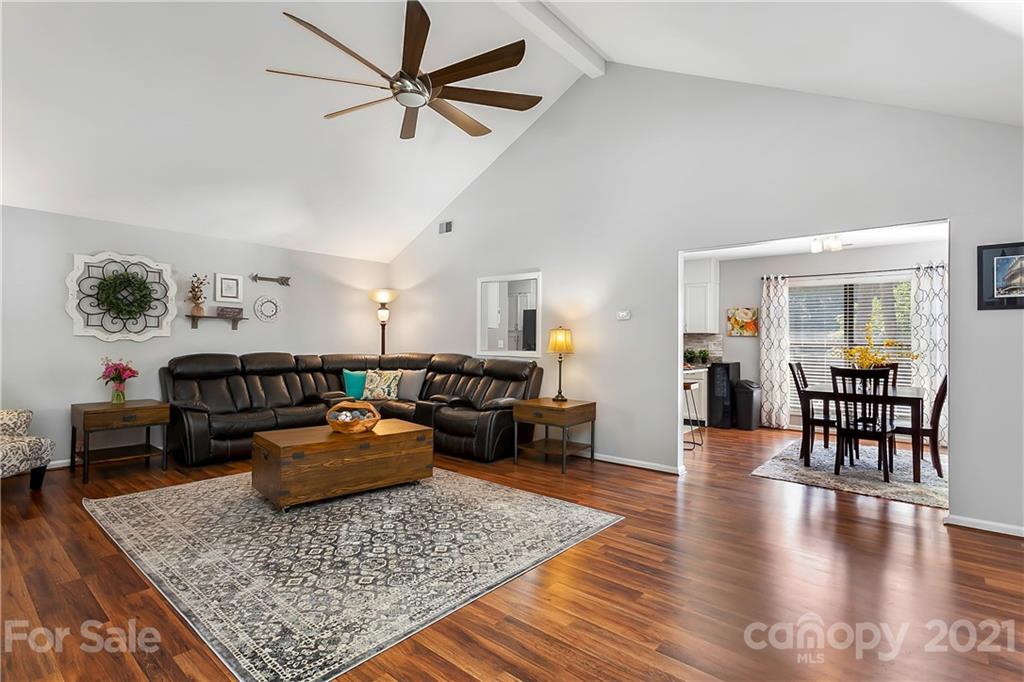 5063 Suwarrow Circle Tega Cay, SC 29708 - Photo 8 of 18 a living room with furniture and wooden floor