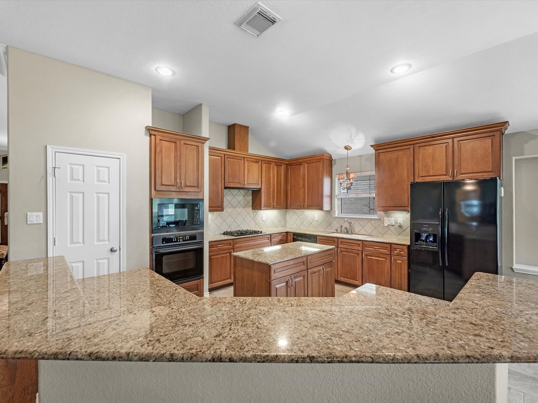 19019 Relay Road Humble, TX 77346 - Photo 13 of 31 a kitchen with stainless steel appliances granite countertop sink refrigerator and stove