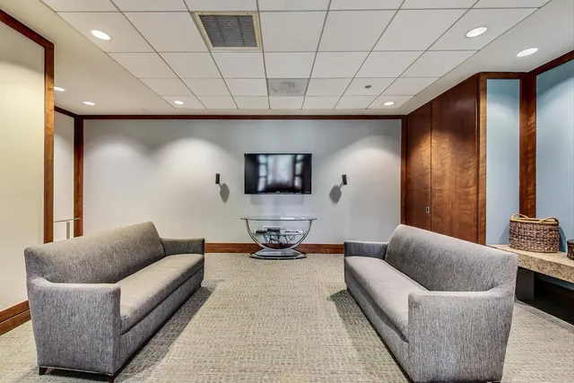 a view of a backyard with sitting area