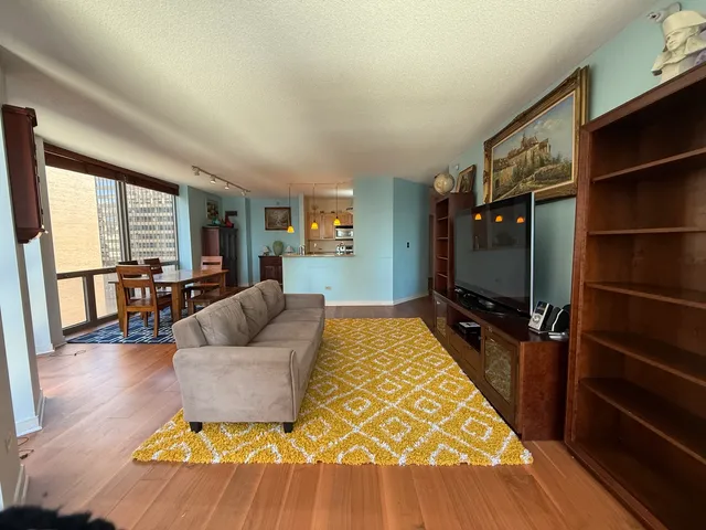 a living room with furniture and large windows