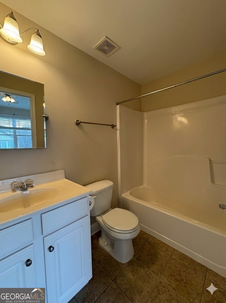 135 Oconee River Circle Athens, GA 30605 - Photo 13 of 17 a bathroom with a sink a toilet and shower