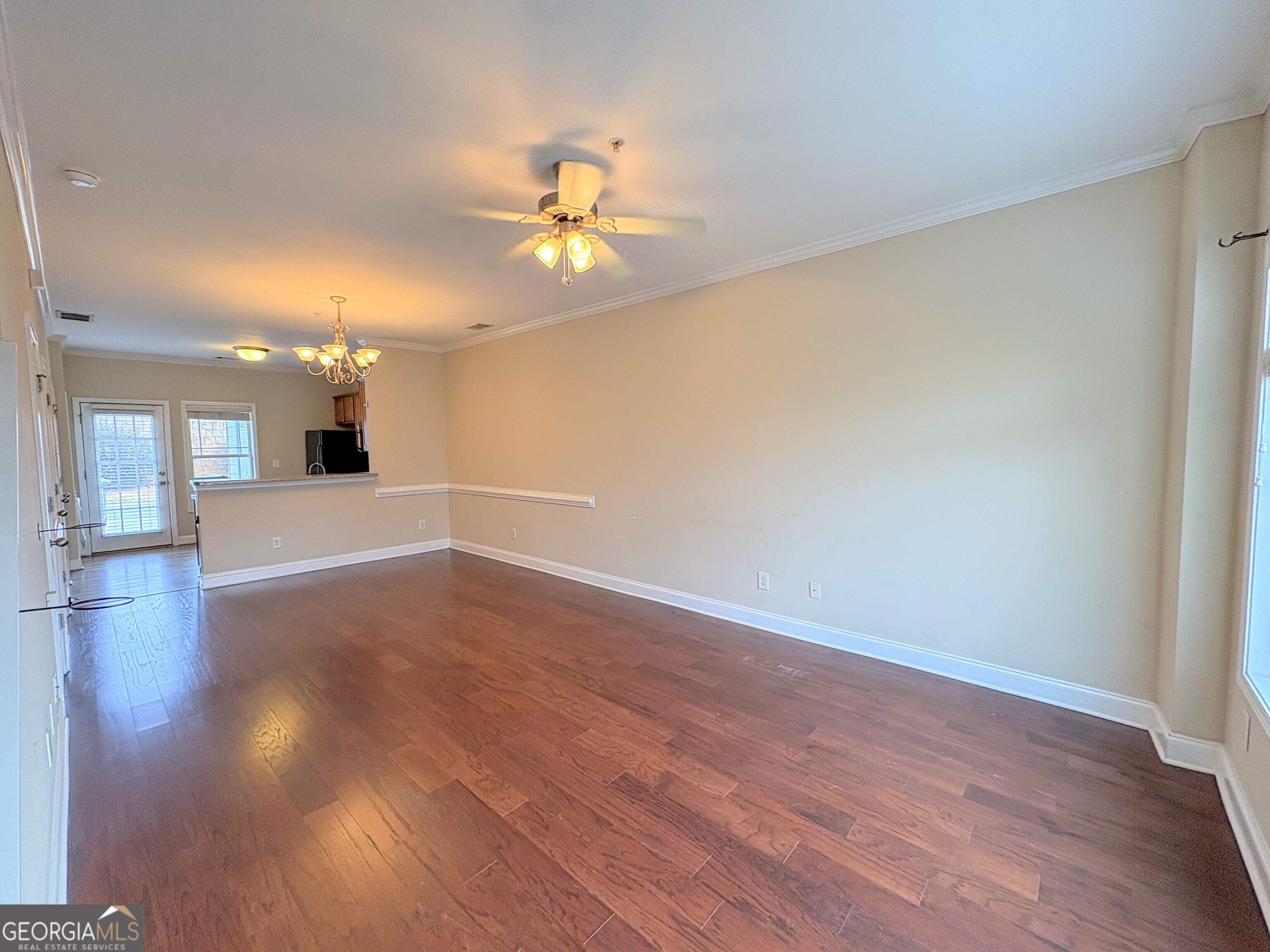 135 Oconee River Circle Athens, GA 30605 - Photo 2 of 17 a view of an empty room with window and wooden floor
