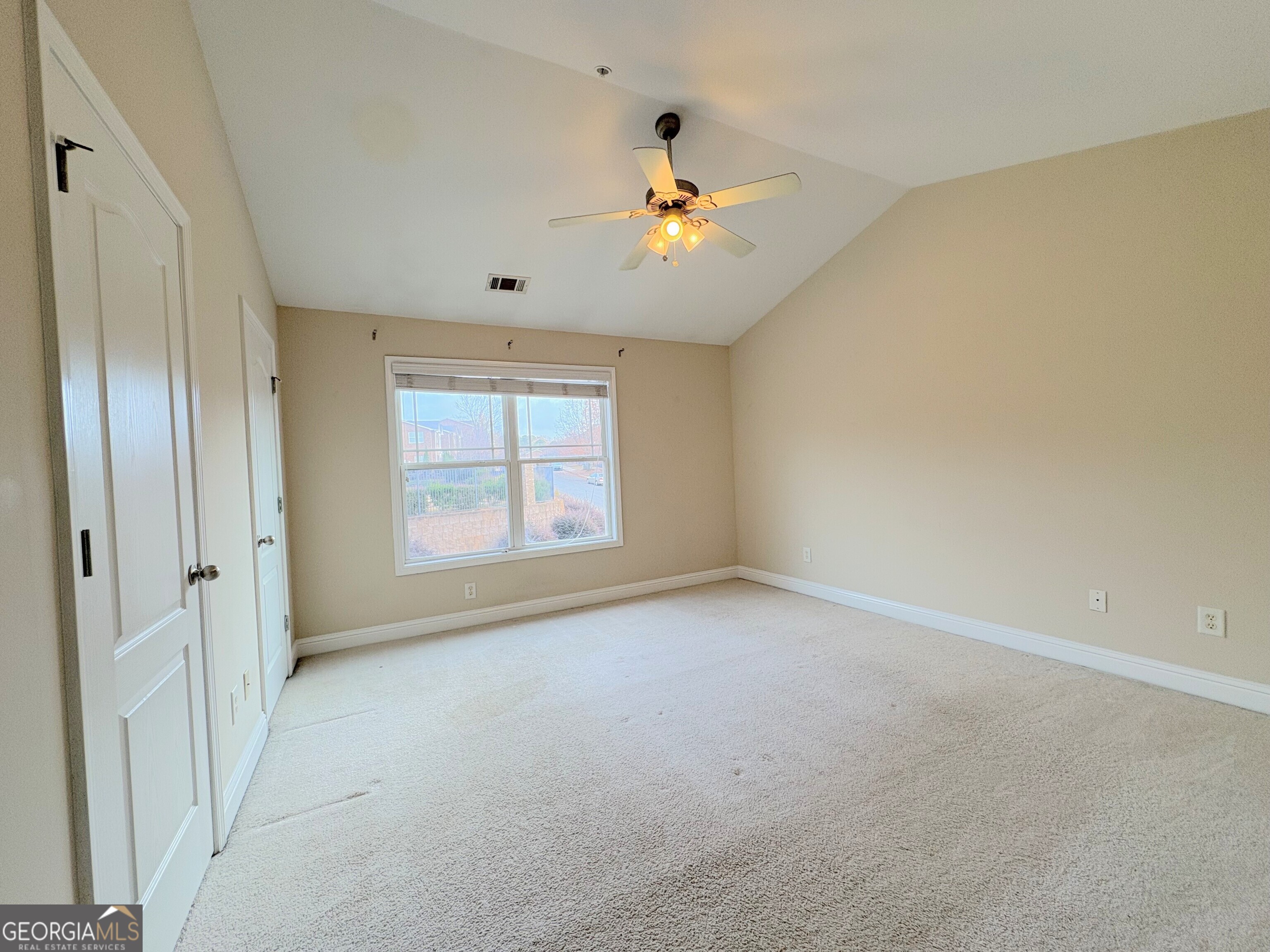 135 Oconee River Circle Athens, GA 30605 - Photo 8 of 17 a view of an empty room with a window