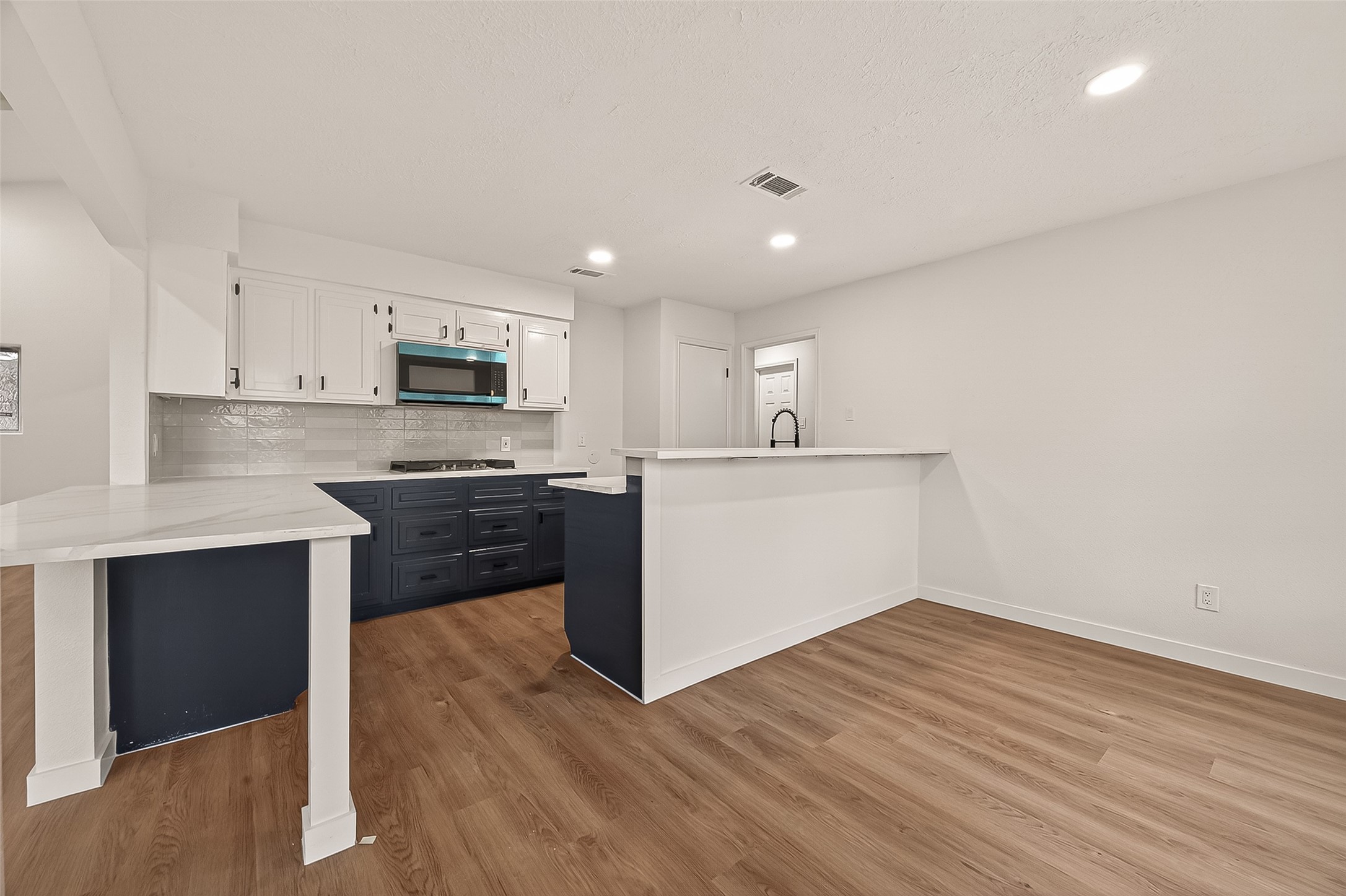 4415 Anacacho Street Pasadena, TX 77504 - Photo 11 of 45 a kitchen with a sink cabinets and wooden floor