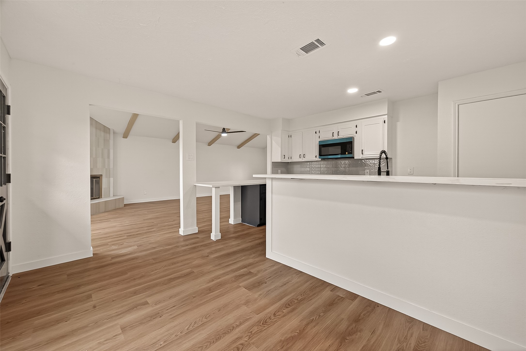 4415 Anacacho Street Pasadena, TX 77504 - Photo 12 of 45 a view of a kitchen with wooden floor and electronic appliances
