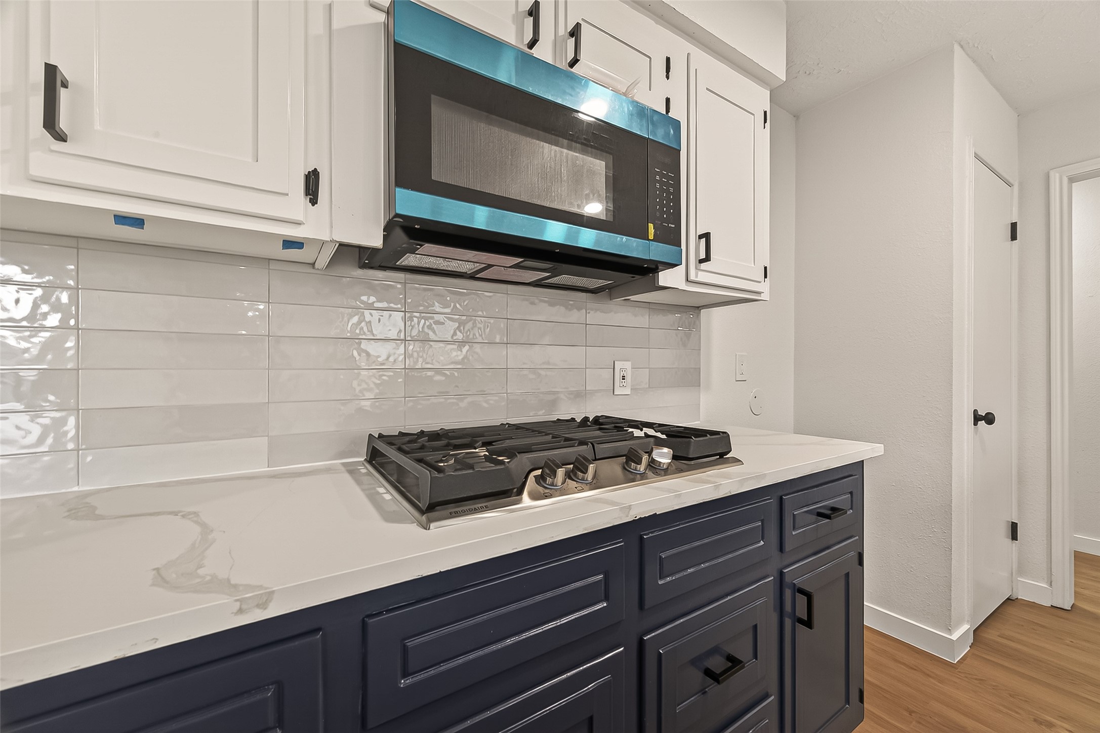 4415 Anacacho Street Pasadena, TX 77504 - Photo 16 of 45 a kitchen with stainless steel appliances granite countertop a sink a stove and cabinets