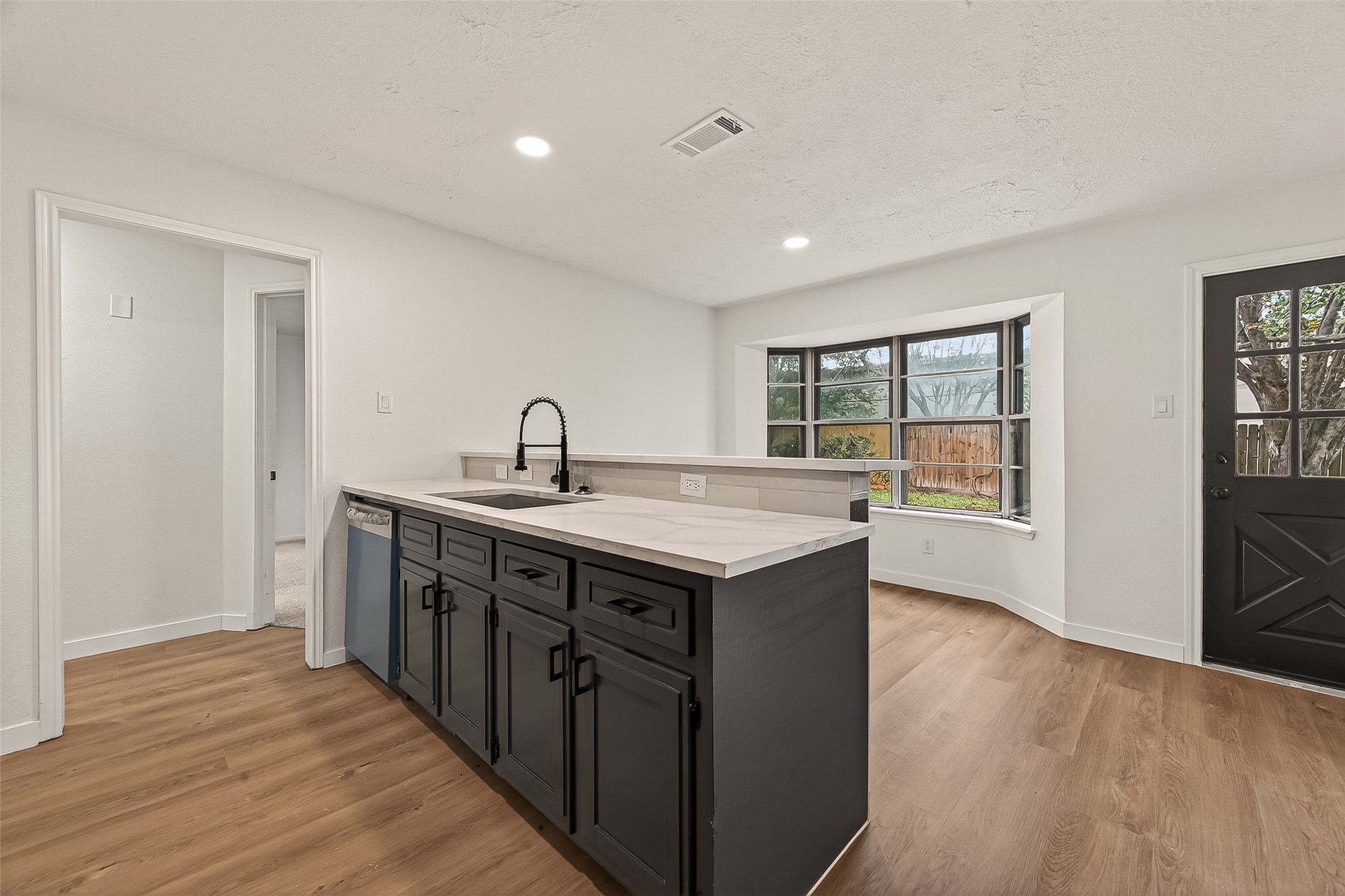 4415 Anacacho Street Pasadena, TX 77504 - Photo 17 of 45 a kitchen with stainless steel appliances granite countertop a sink and wooden cabinets