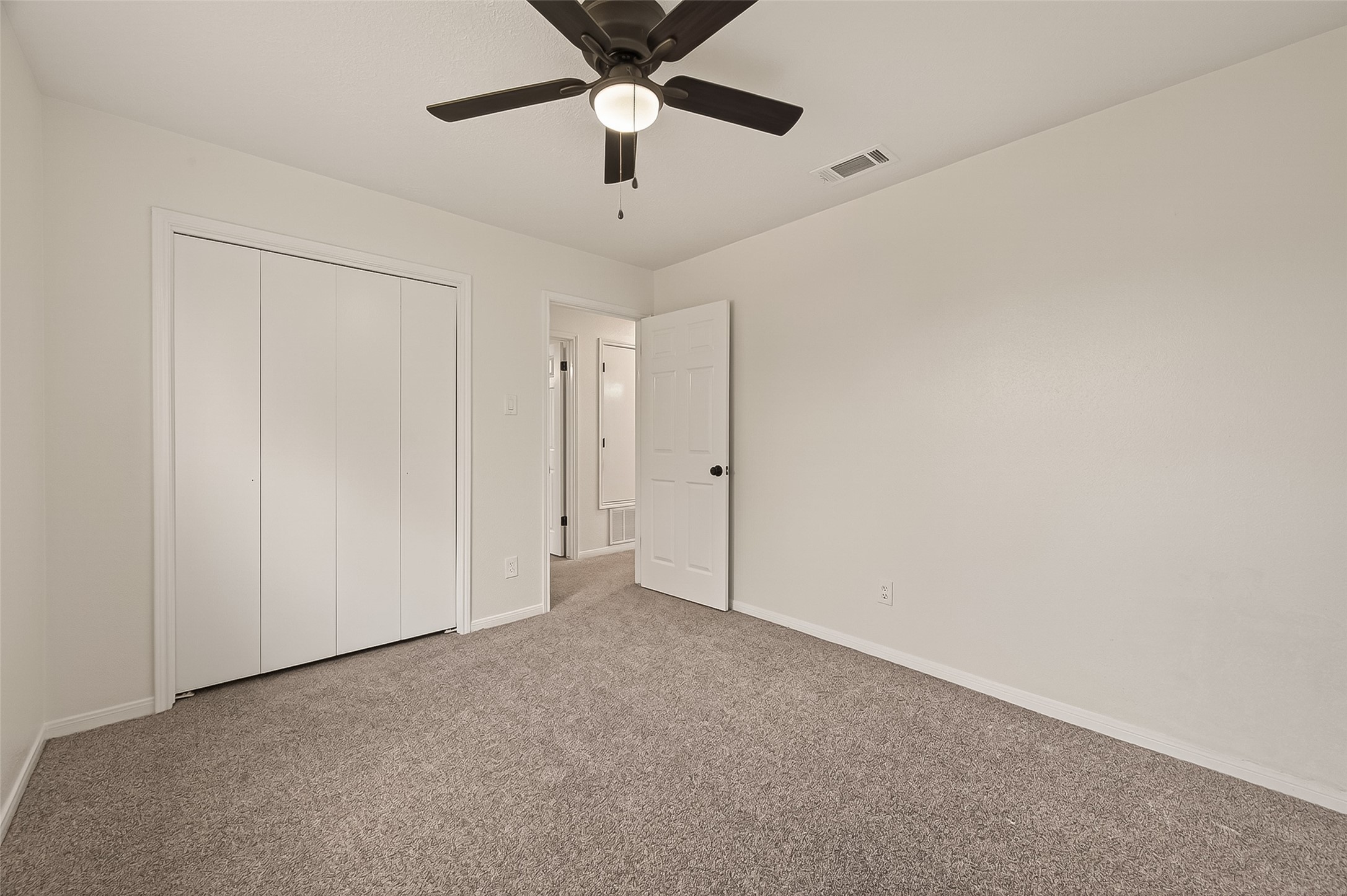 4415 Anacacho Street Pasadena, TX 77504 - Photo 21 of 45 an empty room with a ceiling fan and a fan