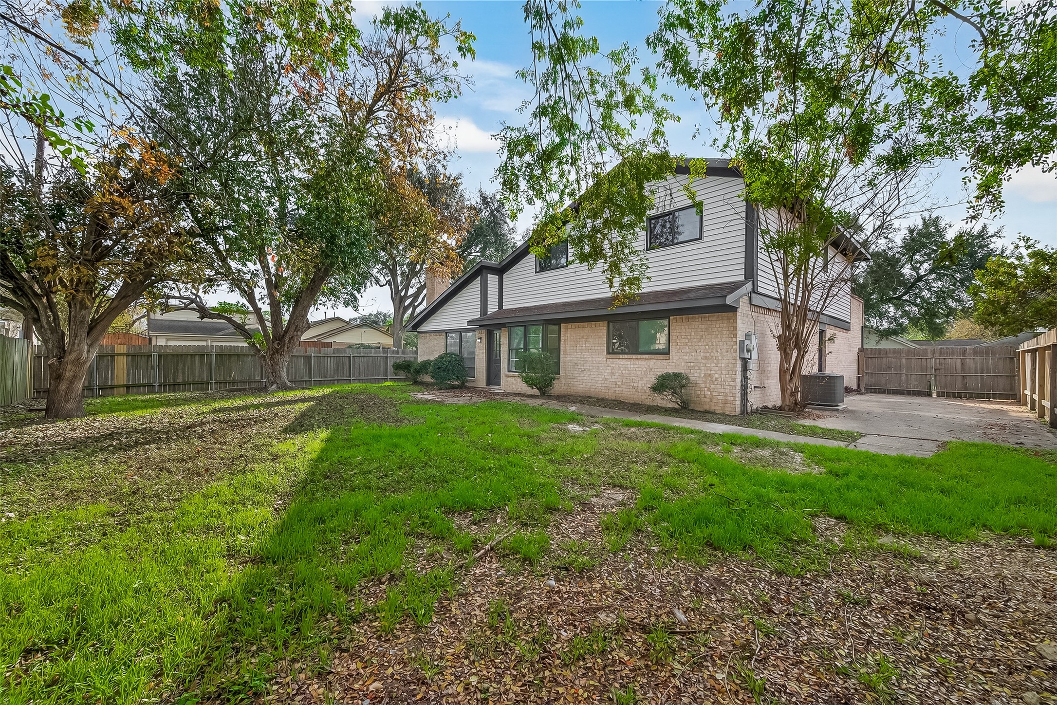 4415 Anacacho Street Pasadena, TX 77504 - Photo 42 of 45 a view of a house with backyard and a tree