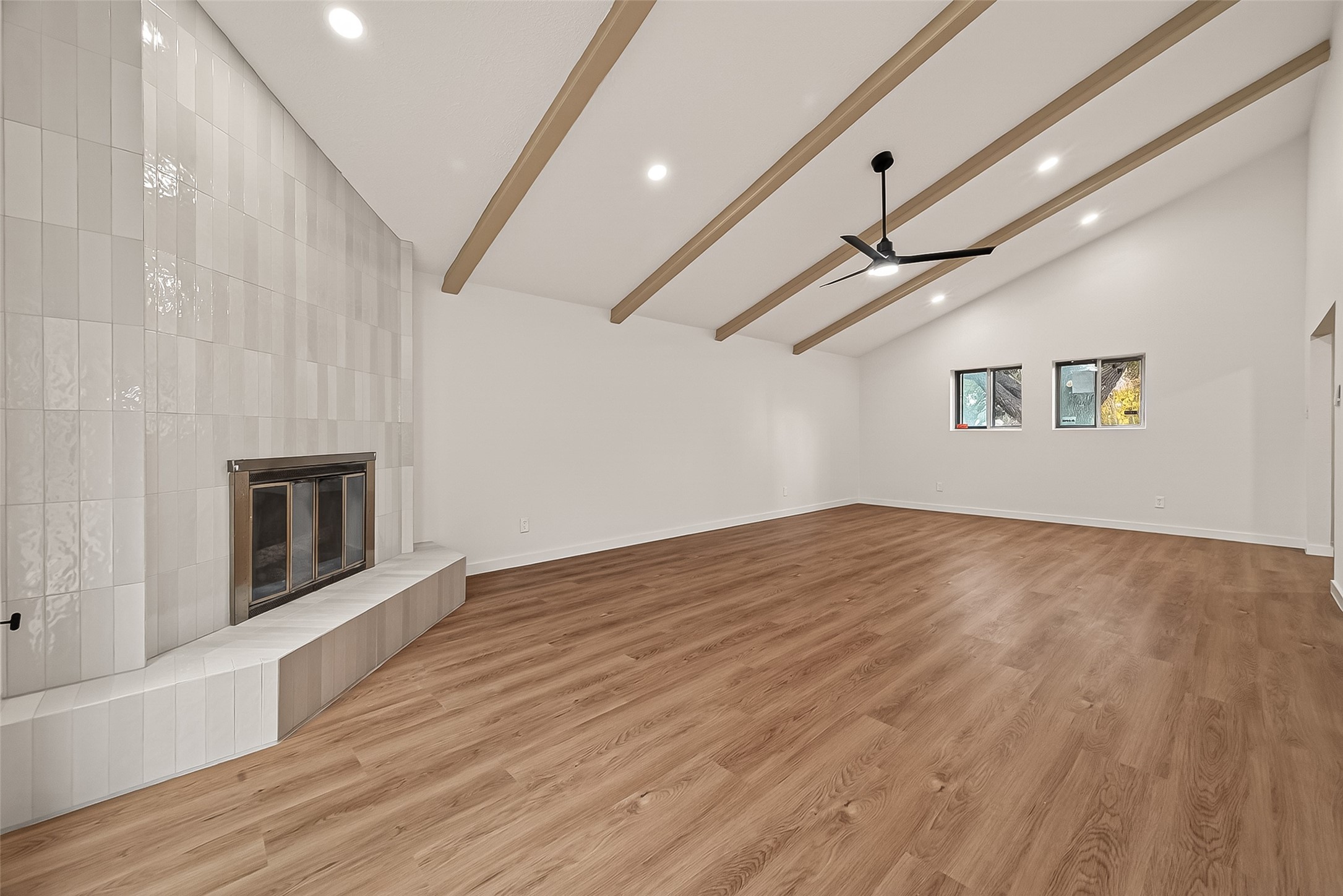 4415 Anacacho Street Pasadena, TX 77504 - Photo 10 of 45 a view of an empty room with wooden floor and a window