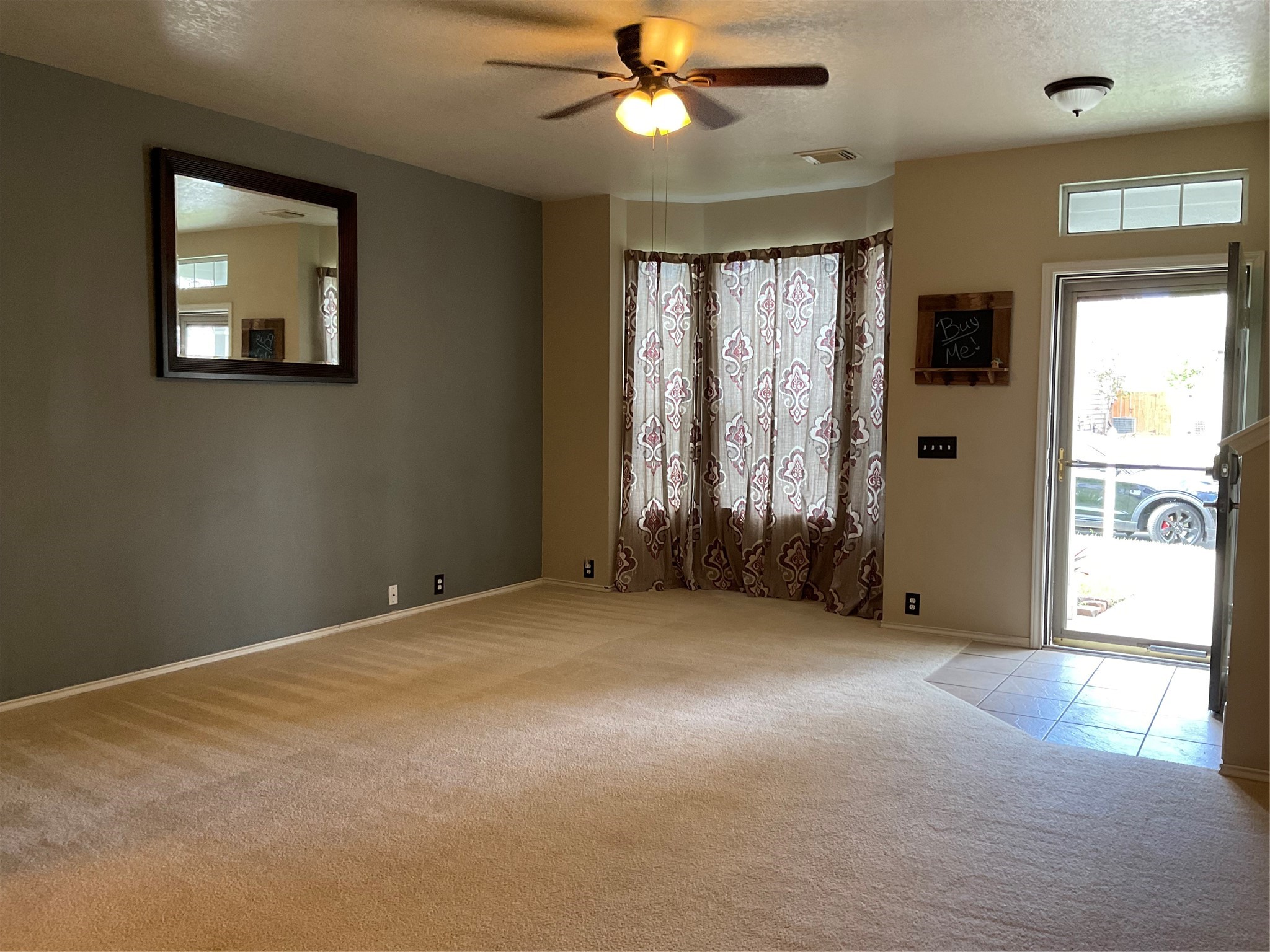 2110 Rustling Trees Way Spring, TX 77373 - Photo 11 of 36 View of the living room not staged. Notice the Bay Windows and the Glass Storm Door.