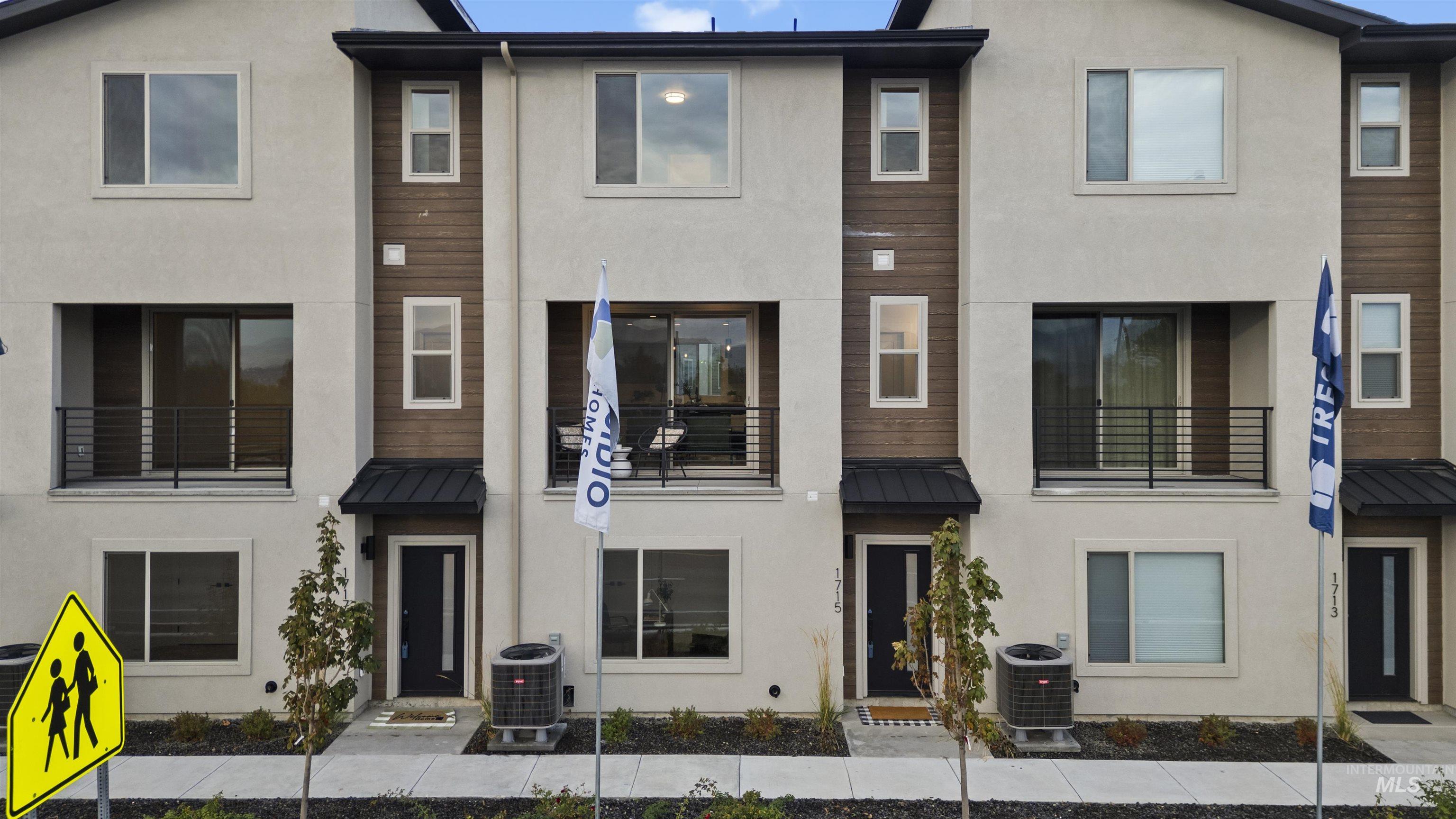 1705 South Federal Way Boise, ID 83705 - Photo 34 of 34 View of front facade featuring a standing seam roof, a metal roof, and stucco siding