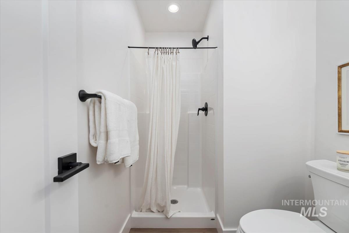 1705 South Federal Way Boise, ID 83705 - Photo 7 of 34 Bathroom featuring a stall shower and toilet