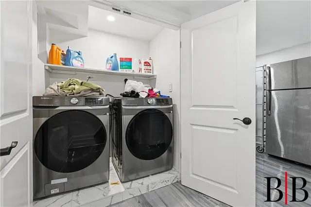 a utility room with dryer and washer