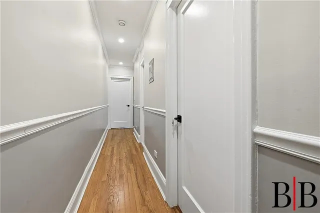 a view of gallery with wooden floor