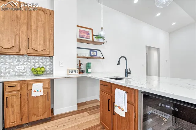 a kitchen with stainless steel appliances a sink and cabinets