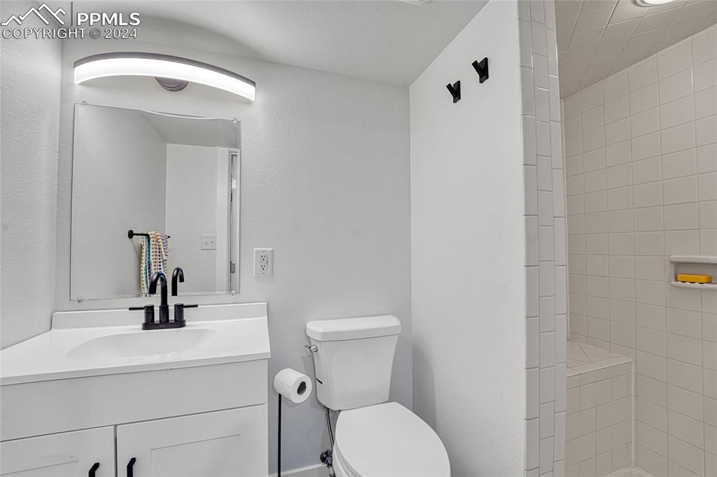 2004 Glenhill Road Colorado Springs, CO 80906 - Photo 36 of 43 a bathroom with a sink a toilet and shower