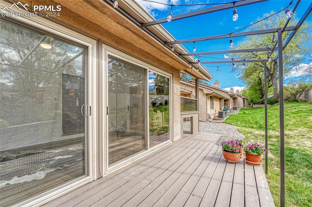 2004 Glenhill Road Colorado Springs, CO 80906 - Photo 40 of 43 a view of a porch with wooden floor and outdoor space