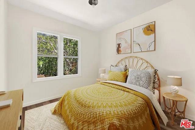 a bedroom with a bed and window