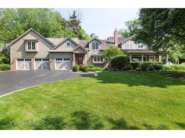 14 West Sunset Road Chicago, IL 60647 - Photo 1 of 25 a front view of a house with a yard and trees