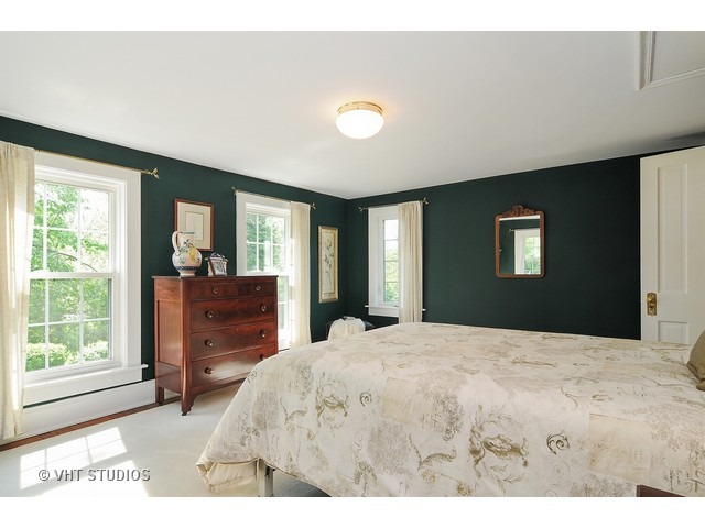 14 West Sunset Road Chicago, IL 60647 - Photo 14 of 25 a bed room with a bed window and a mirror