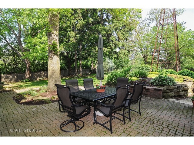 14 West Sunset Road Chicago, IL 60647 - Photo 19 of 25 a view of a backyard with table and chairs