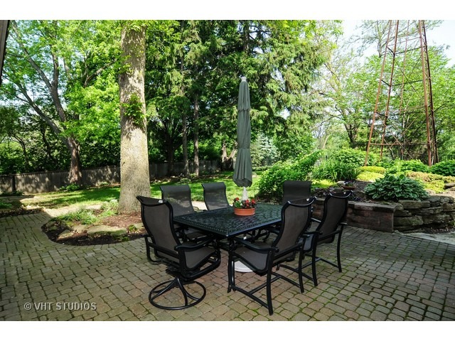 14 West Sunset Road Chicago, IL 60647 - Photo 24 of 25 a backyard of a house with a yard and outdoor seating