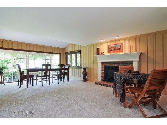 14 West Sunset Road Chicago, IL 60647 - Photo 6 of 25 a dining room with furniture and a fireplace